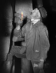 miner with candle